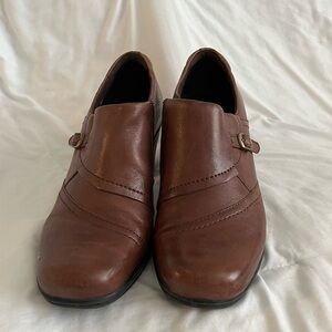 Woman’s brown  Clark shoes